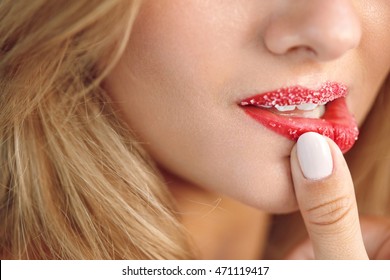 Lip Skin Care. Closeup Of Beautiful Woman's Mouth With Cosmetic Sugar Lip Scrub On. Girl Touching, Exfoliating Her Plump Full Lips Using Scrub To Get Soft Lips. Beauty Concept. High Resolution Image