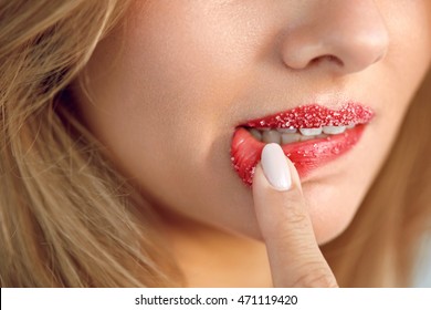 Lip Skin Care. Closeup Of Beautiful Woman's Mouth With Cosmetic Sugar Lip Scrub On. Girl Touching, Exfoliating Her Plump Full Lips Using Scrub To Get Soft Lips. Beauty Concept. High Resolution Image