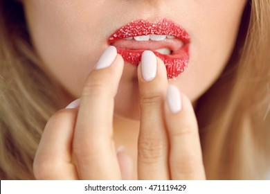 Lip Skin Care. Closeup Of Beautiful Woman's Mouth With Cosmetic Sugar Lip Scrub On. Girl Touching, Exfoliating Her Plump Full Lips Using Scrub To Get Soft Lips. Beauty Concept. High Resolution Image