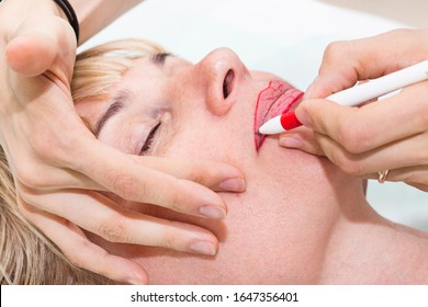 Lip Tattoo And Correction Of The Shape Of A Middle-aged Woman In A Beauty Salon.
