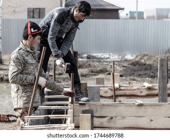 LIPETSK, RUSSIA - MAY 29, 2020: Workers fill the foundation at a home construction site. - Shutterstock ID 1744689788