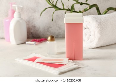 Liposoluble Wax Cartridge And Strips On Table