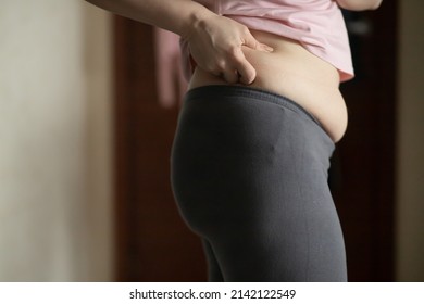 Liposuction, Woman In Front Of A Mirror Looks At Body Volumes, Sports And Diet, Fitness, Body Positivity, Self Acceptance