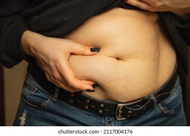 Lipotropic injections close up. Belly fat dissolving treatment. Pendulous Abdomen. Women body after pregnancy. Obesity disease.