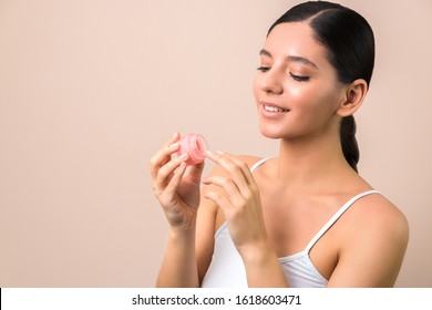 Lips Care And Protection. Woman Applying Lip Mask On Lips