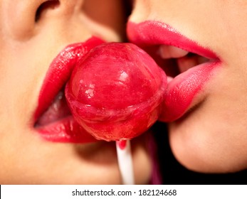 Lips closeup women kissing in erotic foreplay game. Isolated.