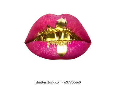 Lips with gold teeth and liquid gold on the lips. Lips with pink lipstick and gold isolated on white background. Sexy luxury female mouth. Macro of beautiful lips with pink and gold lipstick