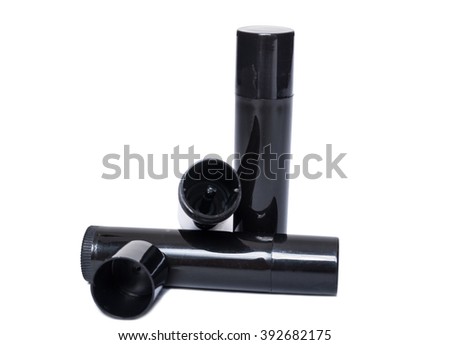 Lips moisturizer black plastic containers isolated on white. Blank copy space as advertsing area