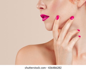Lips nails hand Beautiful woman portrait with perfect make up manicure pink lips and nails on beige background isolated