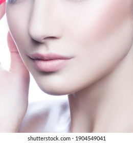 Lips. Part of face and neck of beauty girl with natural nude makeup, clean perfect clean skin