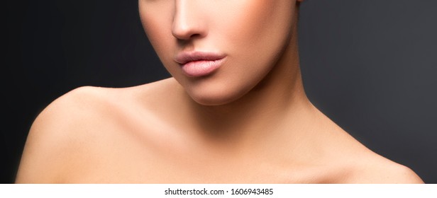 Lips, Shoulders, Part Of Beauty Face Of Model Woman. Perfect Healthy Sin, Nude Natural Make-up. Skincare Facial Treatment Concept. Dark Background