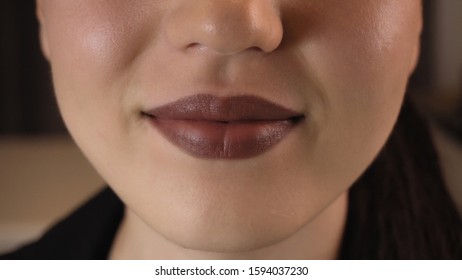 Lips Of A Young Woman Close-up. Bright Burgundy Lips.