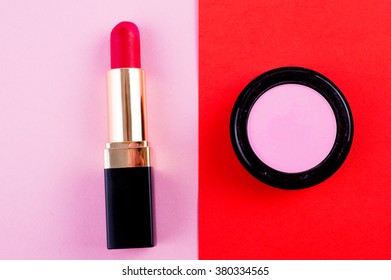 Lipstick, Eye Shadow And Brush In Bright Fashion Background. Pink, Red And Fuchsia Makeup