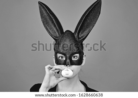 Similar – Young woman wearing rabbit ears and kissing