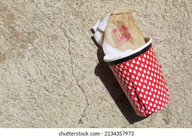 Lipstick Mark On Tissue Paper In A Glass. 