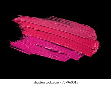 Lipstick multicolored smudged on black isolated background