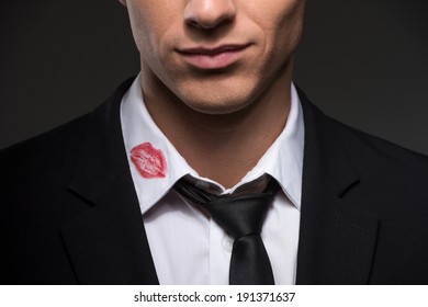 Lipstick on your collar. Man with lipstick on his collar