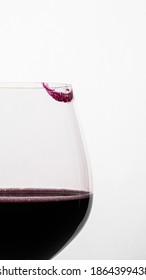 Lipstick Print On A Red Wine Glass On A White Background