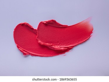 Lipstick Red Smudge Swatch On Blue Purple Colored Background