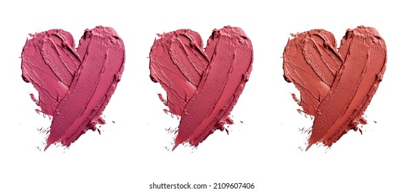 lipstick smudge or color paint heart shape texture on white background. Beauty makeup product swatch and love concept  