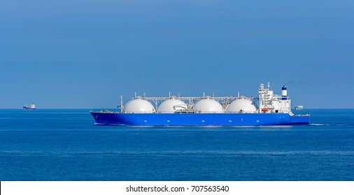 Liquefied natural gas (LNG) tanker is passing by Strait of Singapore.