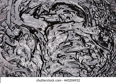 Liquid bitumen surface - Shutterstock ID 443204932