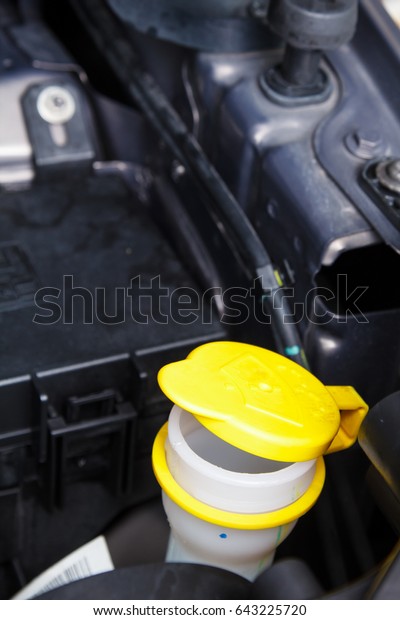 Liquid caps\
for windshield washer inside car\
engine
