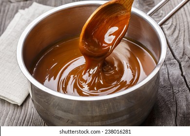 liquid caramel is poured into a gravy boat