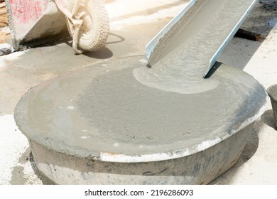 Liquid Cement Water In The Mortar Mixing Tank. Flowing Down From The Plastic Guide Rail. Outdoor Construction Environment.