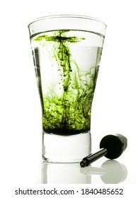 Liquid Chlorophyll In Water Isolated On White Background