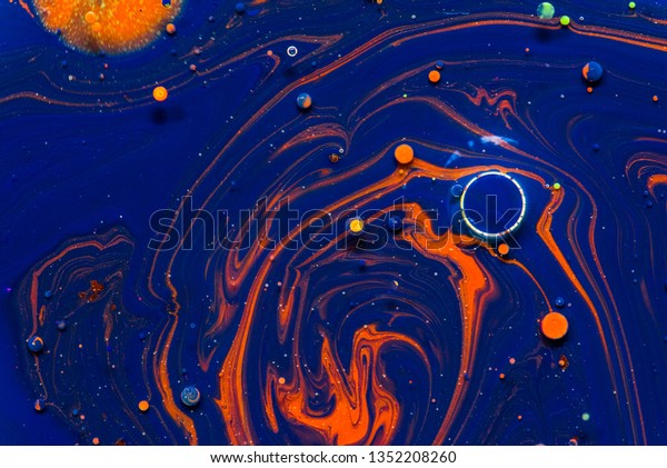 Liquid colorful\
paint background. Creative background with abstract watercolor\
painted waves handmade surface. Close up of different watercolor\
paint. concept colorful\
space.