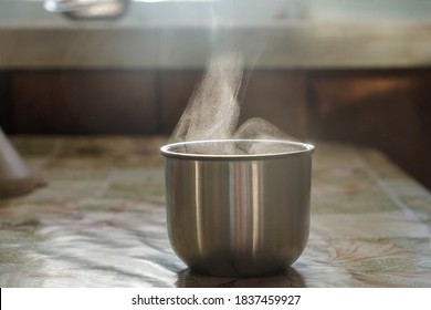 Liquid Evaporation. Thermos Cup With A Hot Drink On A Cold Morning. Smoke And Steam.