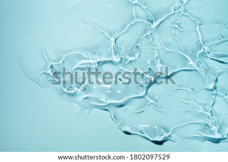 Liquid gel cosmetic smudge blue background