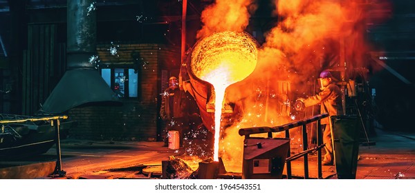 Liquid iron molten metal pouring in container, industrial metallurgical factory, foundry cast, heavy industry background