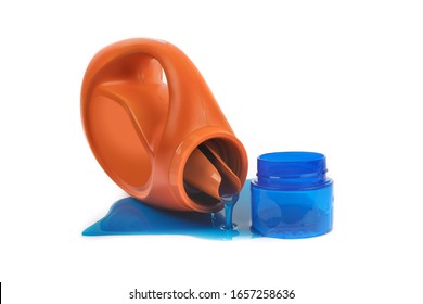 liquid laundry detergent pouring out of a tipped over bottle of detergent isolated on white - Powered by Shutterstock