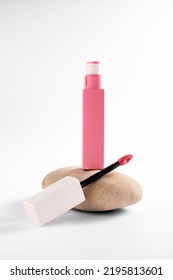 Liquid Lipstick And Applicator Brush With Open Tube. Makeup Cosmetic Product. Bright Background