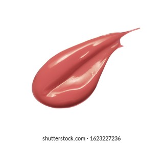 Liquid lipstick swatch smear smudge isolated on white background. Shiny nude color lip gloss stroke swipe. Makeup texture sample