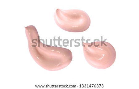 Liquid makeup foundations smear drop on white background.