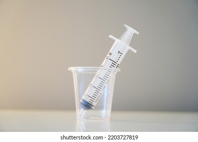 Liquid Medicine In A Cup With The Patient's Oral Syringe,water Pills For Children
