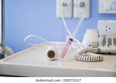 Liquid Medicine In A Cup With The Patient's Oral Syringe,water Pills For Children,Press The Emergency Button To Call The Nurse In A Hospital Emergency.
