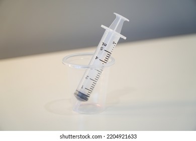 Liquid Medicine In A Cup With The Patient's Oral Syringe,water Pills For Children
