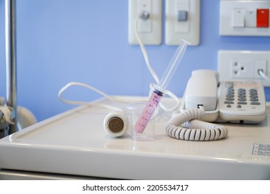 Liquid Medicine In A Cup With The Patient's Oral Syringe,water Pills For Children,Press The Emergency Button To Call The Nurse In A Hospital Emergency.
