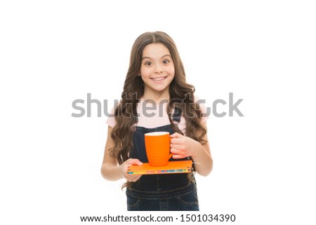 Liquid obtained by suspending soybean flour in water. Delicious drink recipe. Small child holding cup with warm milk drink. Little girl enjoying hot drink. Cute kid taking drink of tea with milk.