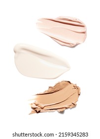 Liquid Smears Of Makeup Highlighter, Concealer And Tone Foundation Isolated On White Background