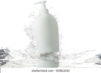 liquid soap dispenser and bubbles over rippled water