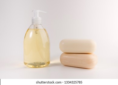 Liquid Soap And Two Pieces Of Solid Soap Isolated On  White Background