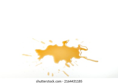 Liquid stain dirty splashing on floor. Tea or coffee stain splash on white background. Yellow brown stain of  liquid pouring on white surface - Shutterstock ID 2164431185