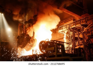Liquid steel is poured from a metallurgical ladle