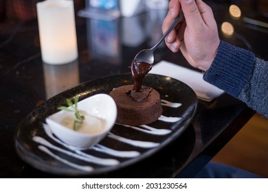 Liquid White Chocolate Souffle On Black Plate