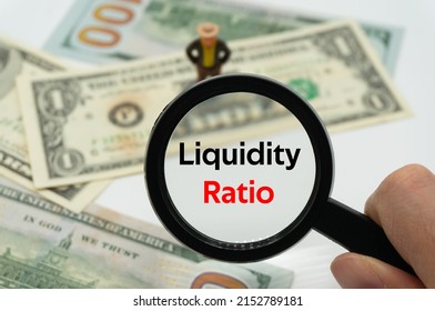 Liquidity Ratio.Magnifying Glass Showing The Words.Background Of Banknotes And Coins.basic Concepts Of Finance.Business Theme.Financial Terms.